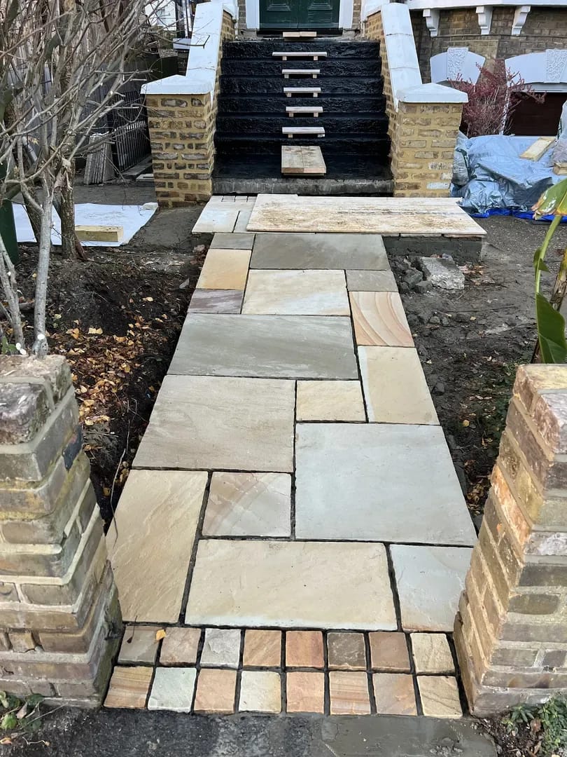 Elegant stone pathway and steps leading to a Victorian London property