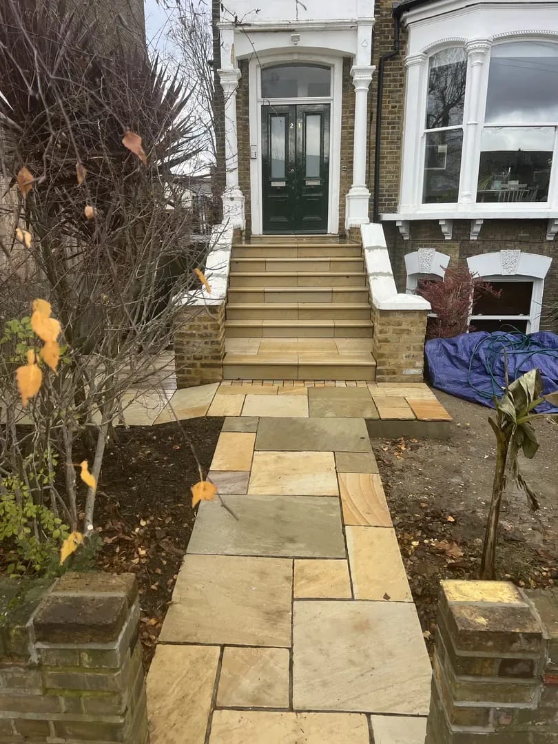 Completed natural stone steps and paving at a Victorian London entrance