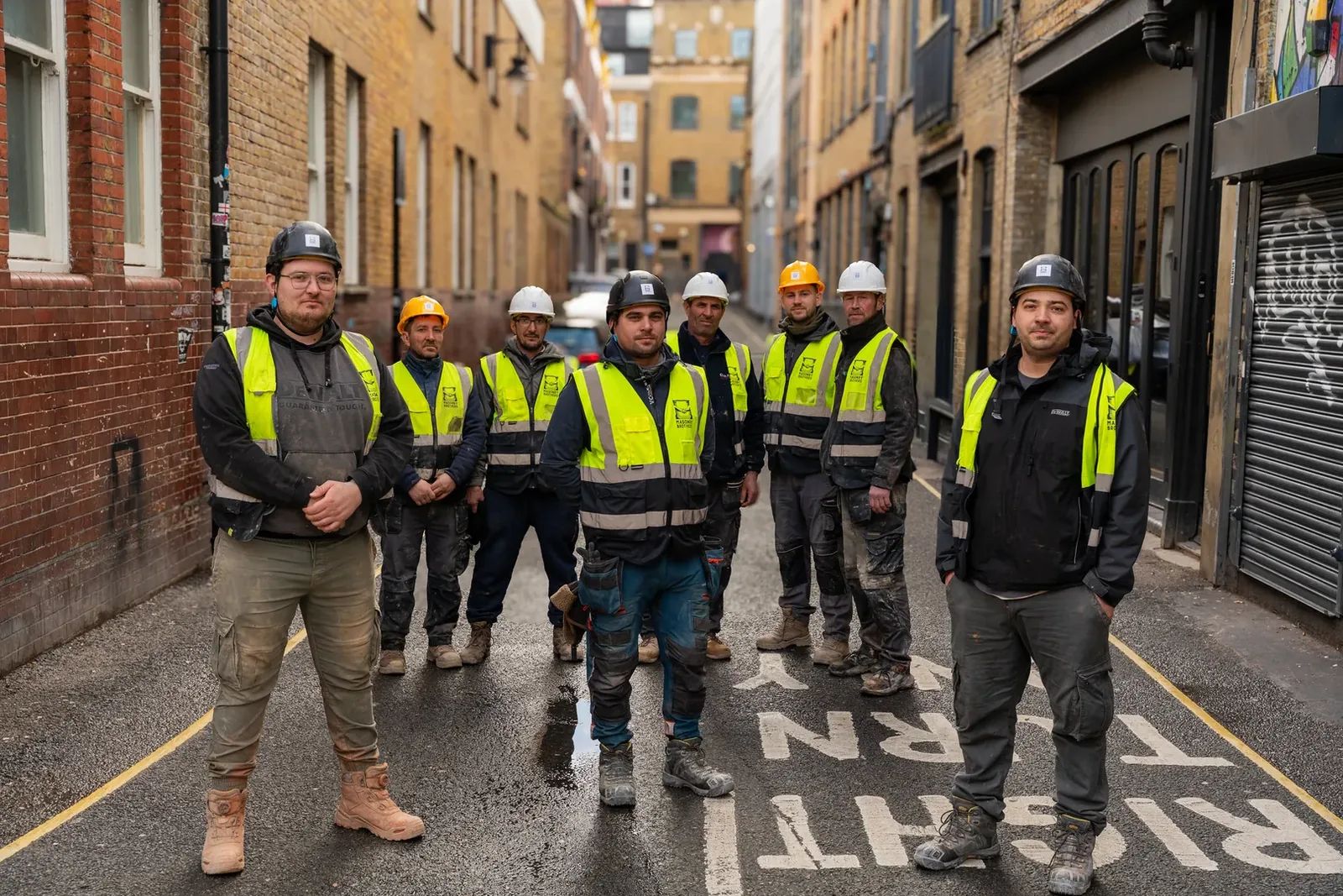 Full Masonry Brothers team in a wide composition